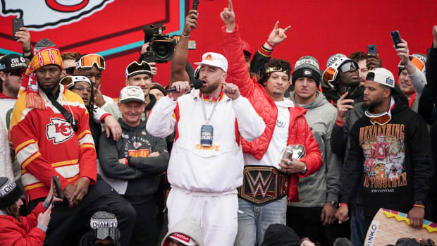 Feb 15, 2023; Kansas City, Missouri, USA; Kansas City Chiefs tight end Travis Kelce (87) speaks during the Kansas City Chiefs Super Bowl parade. Mandatory Credit: Denny Medley-USA TODAY Sports